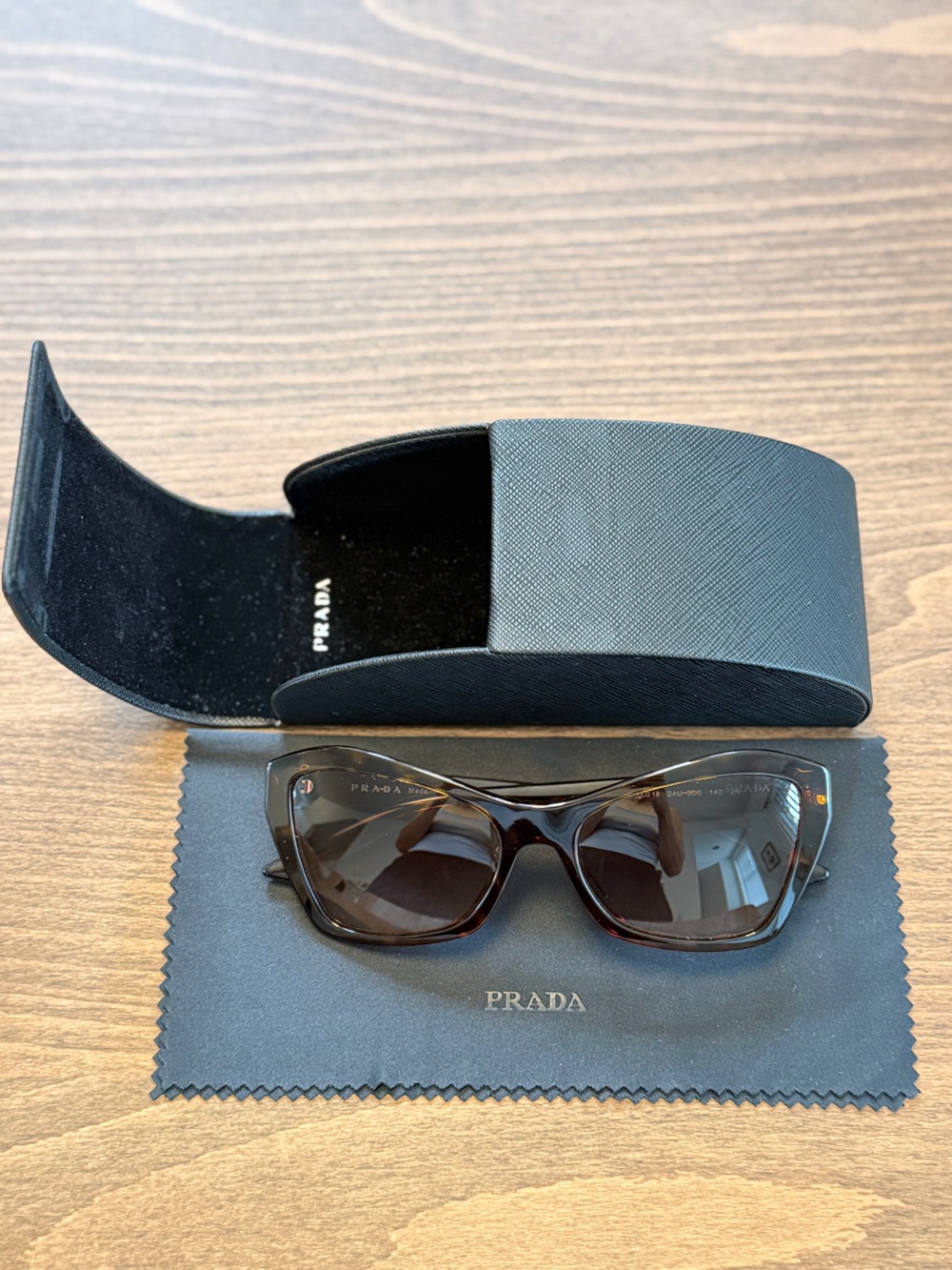 Prada Women's Sunglasses in Dark Brown